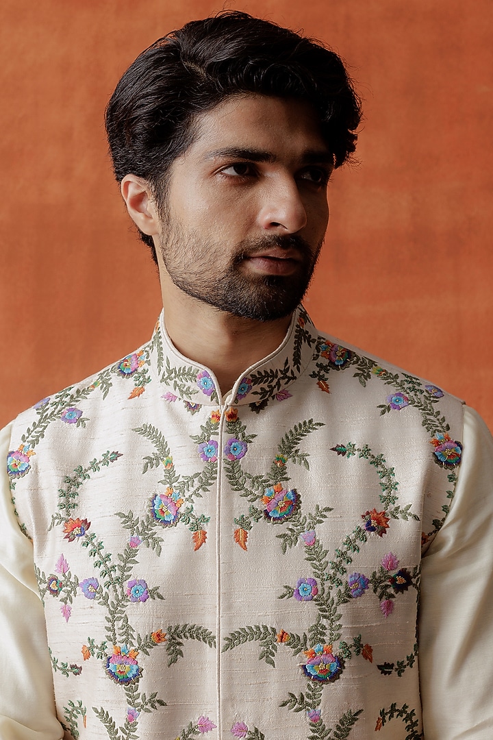 Ivory Raw Silk Kashmiri Embroidered Bundi Jacket by ALLUR at Pernia's Pop Up Shop
