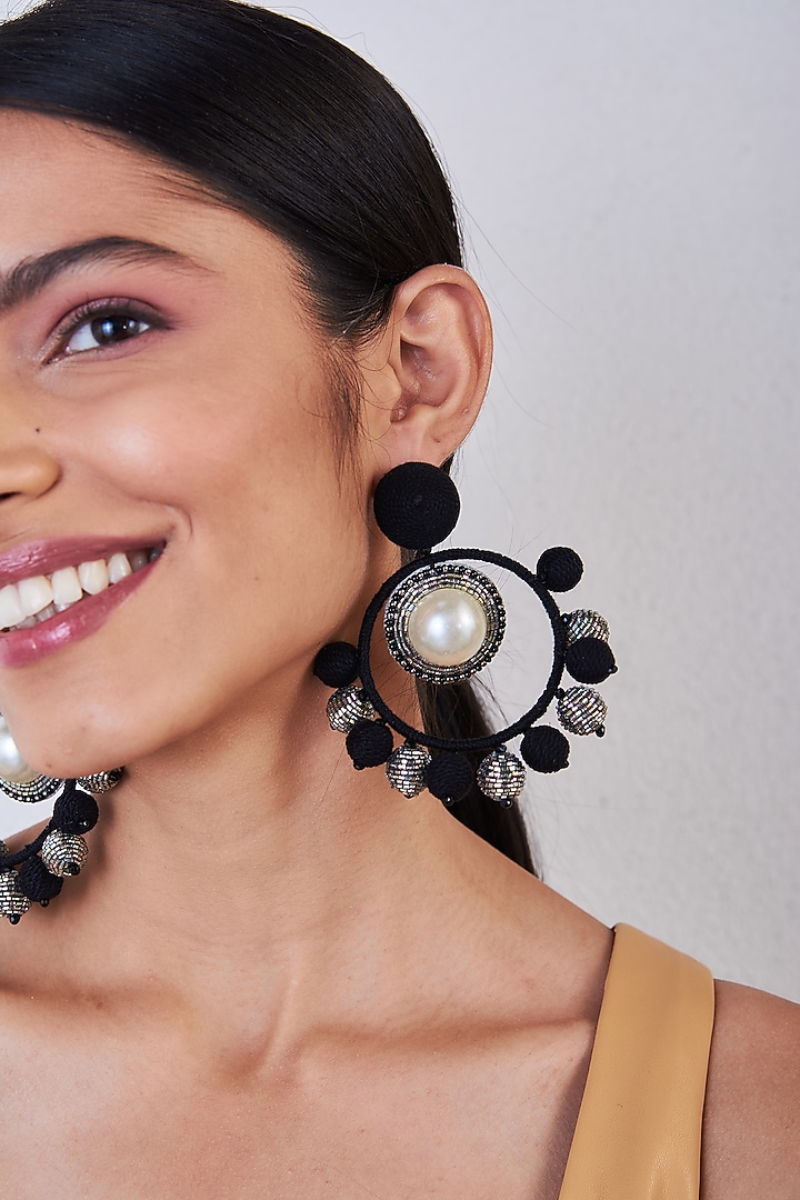 Black Hand Embroidered Ring Earrings by AMAMA at Pernia's Pop Up Shop