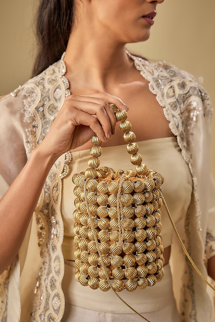 Light Gold Vegan Leather Zari Thread Embroidered Bucket Bag by AMAMA at Pernia's Pop Up Shop