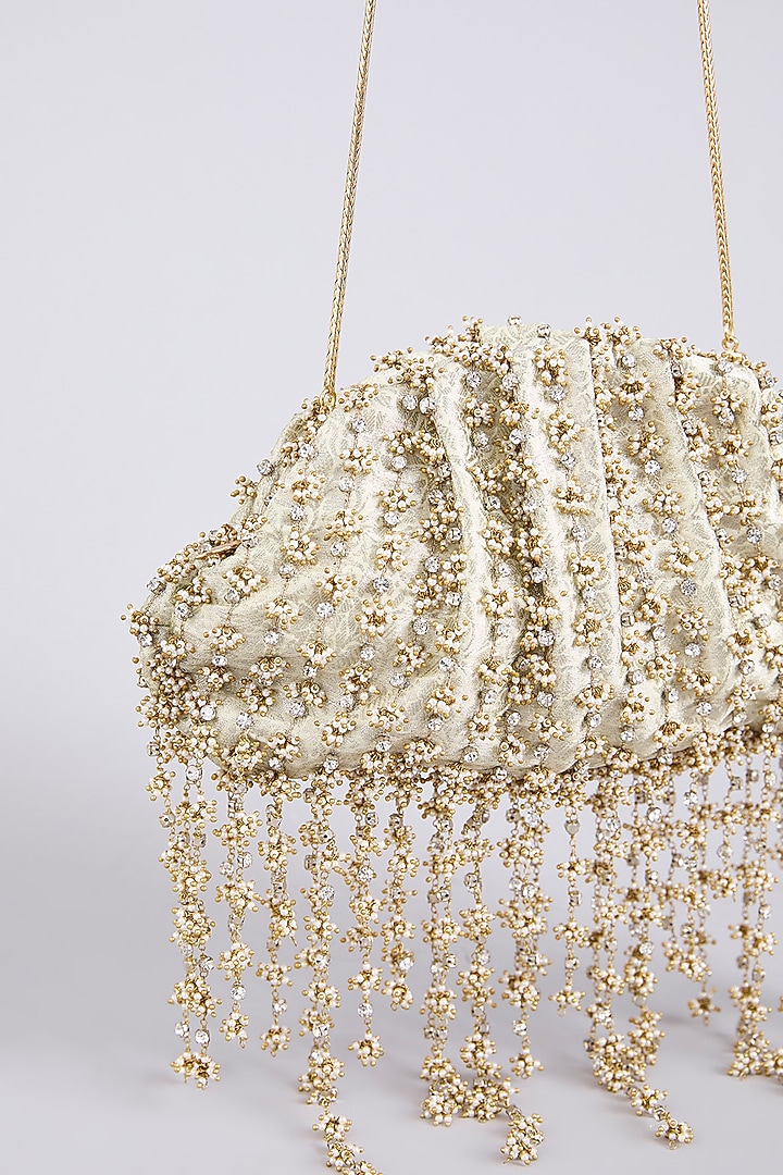 Ivory Brass Sling Bag by AMAMA at Pernia's Pop Up Shop