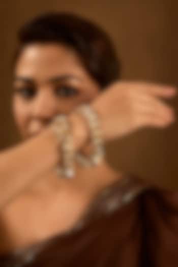 Gold Finish Brass Bangles (Set Of 2) by AMAMA at Pernia's Pop Up Shop