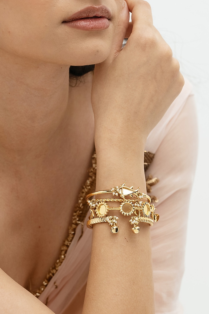 Gold Plated Faux Pearl & Mirror Work Hand Stack Bangles (Set Of 4) by AMAMA at Pernia's Pop Up Shop