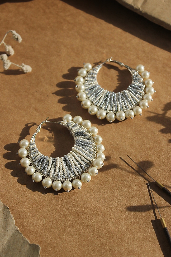 White Glass Hand Embroidered Hoop Earrings by AMAMA at Pernia's Pop Up Shop