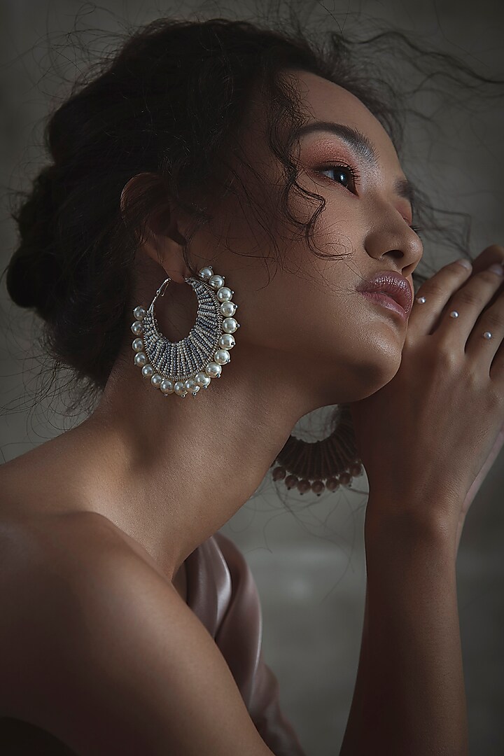 White Glass Hand Embroidered Hoop Earrings by AMAMA at Pernia's Pop Up Shop