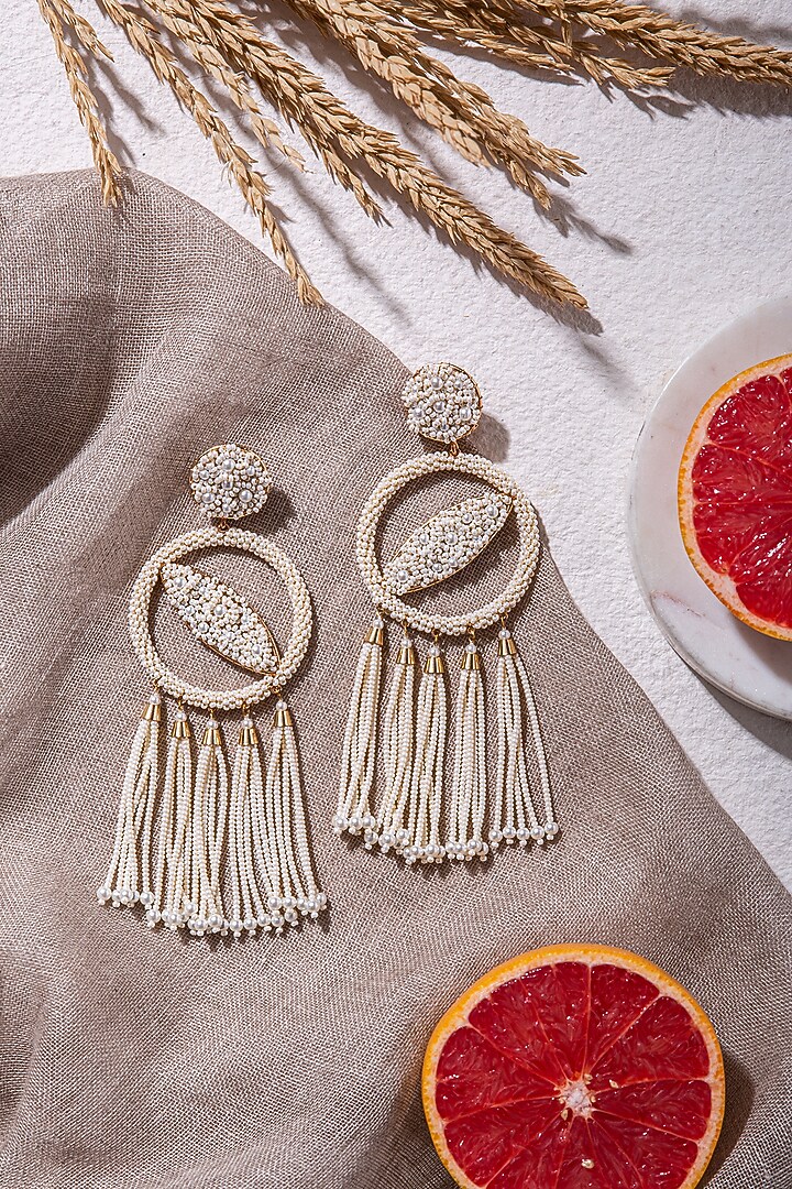 White Embroidered Dangler Earrings by AMAMA at Pernia's Pop Up Shop