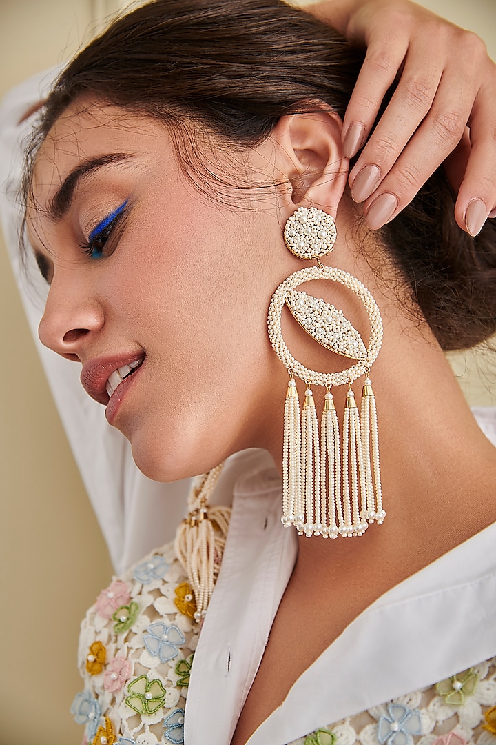 White Embroidered Dangler Earrings by AMAMA