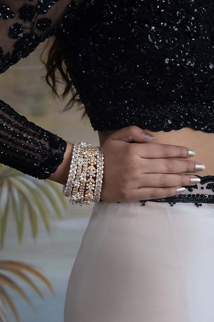 Gold Plated Cubic Zirconia & Faux Pearl Bangles (Set Of 5) by AMAMA at Pernia's Pop Up Shop