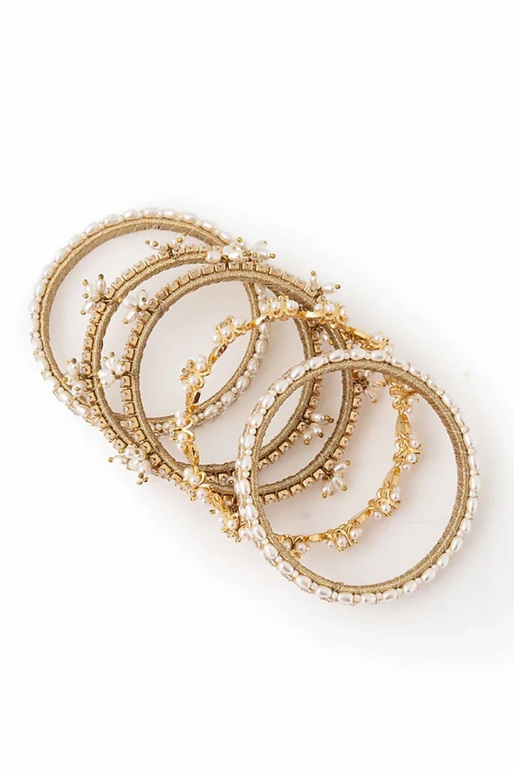 Gold Plated Cubic Zirconia & Faux Pearl Bangles (Set Of 5) by AMAMA at Pernia's Pop Up Shop