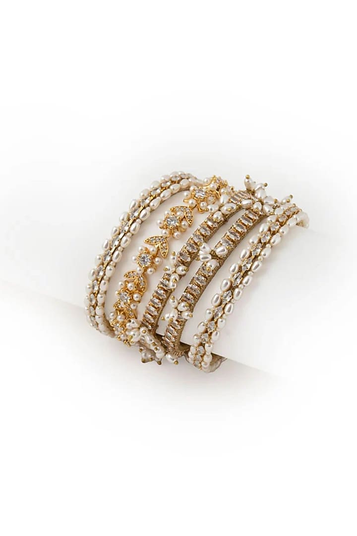 Gold Plated Cubic Zirconia & Faux Pearl Bangles (Set Of 5) by AMAMA at Pernia's Pop Up Shop