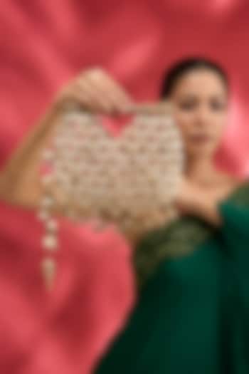 Gold Plated Brass Metal Cowrie Shell Woven Handheld Bag by AMAMA at Pernia's Pop Up Shop