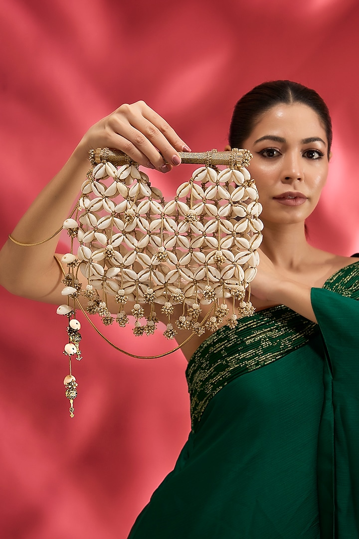 Gold Plated Brass Metal Cowrie Shell Woven Handheld Bag by AMAMA at Pernia's Pop Up Shop