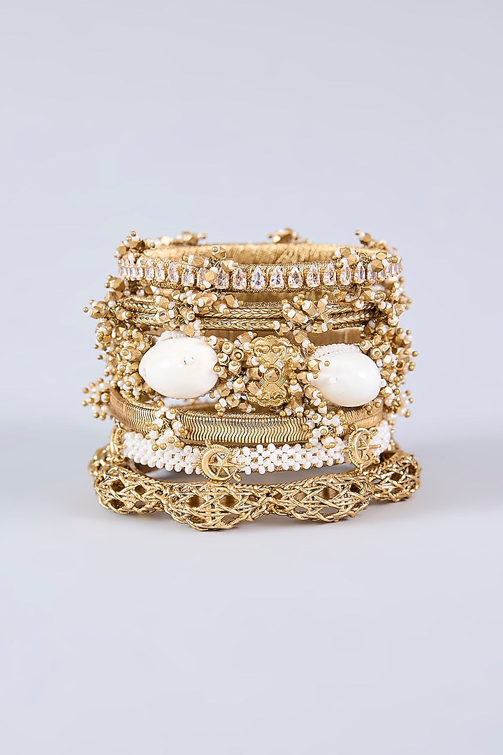 Antique Gold Plated Faux Pearl & Cowrie Shell Bangles (Set Of 6) by AMAMA at Pernia's Pop Up Shop