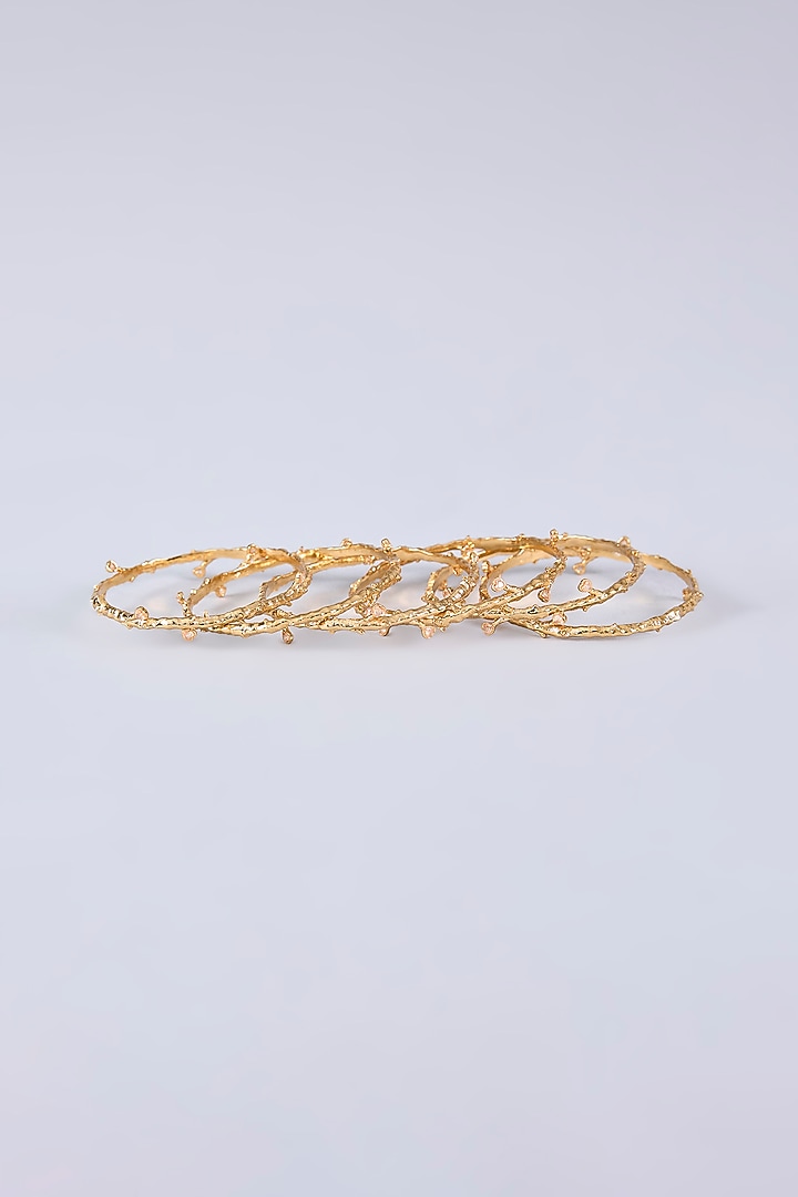 Gold Finish Cubic Zirconia Crest Bangles (Set Of 6) by AMAMA at Pernia's Pop Up Shop