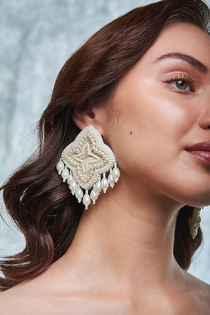 White Hand Embroidered Dangler Earrings by AMAMA at Pernia's Pop Up Shop