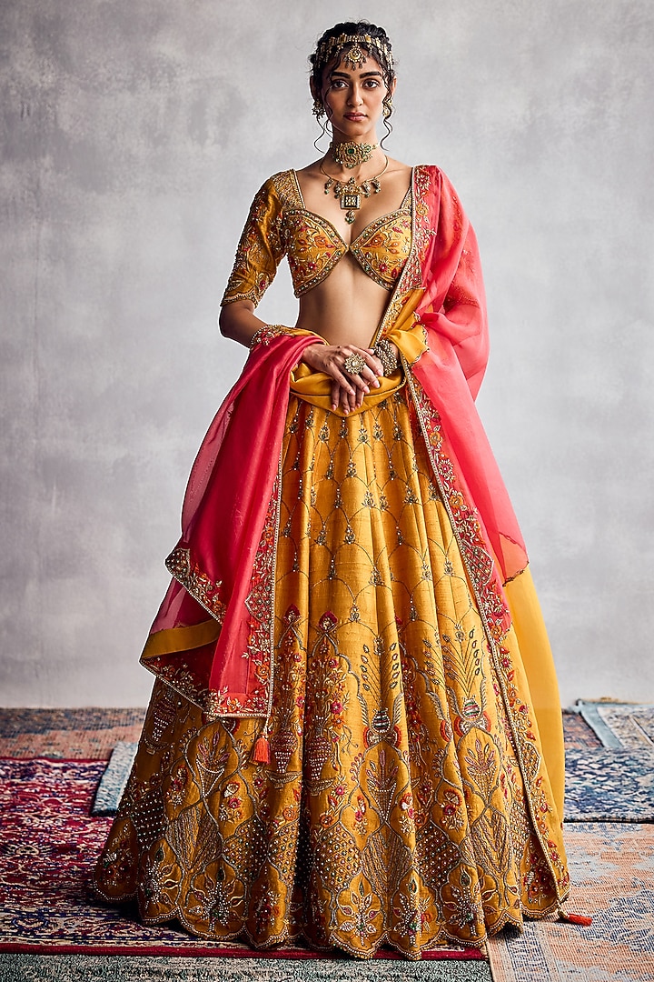 Marigold Raw Silk Floral Hand Embroidered Bridal Lehenga Set by AMAN TAKYAR at Pernia's Pop Up Shop