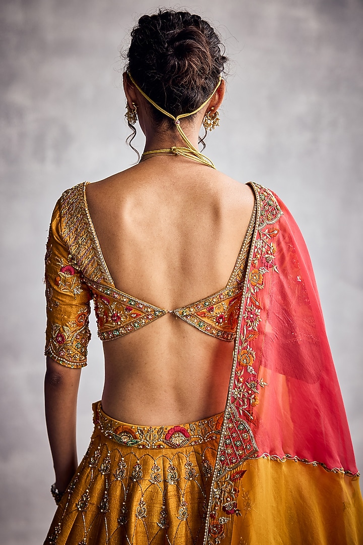 Marigold Raw Silk Floral Hand Embroidered Bridal Lehenga Set by AMAN TAKYAR at Pernia's Pop Up Shop
