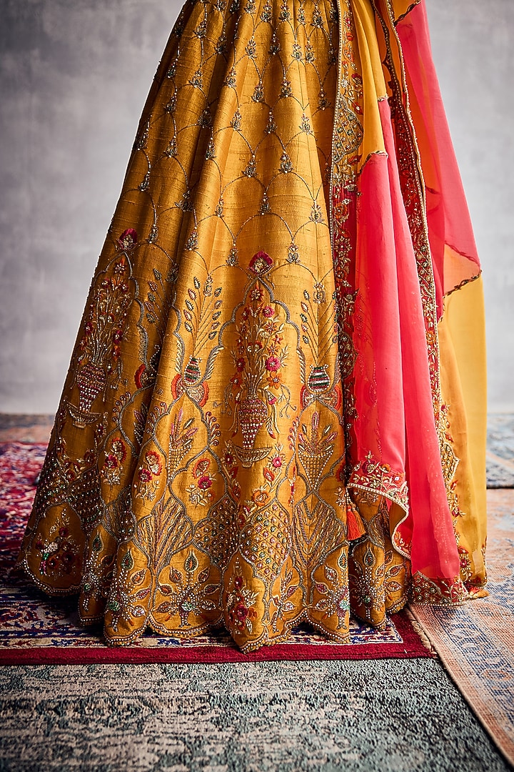 Marigold Raw Silk Floral Hand Embroidered Bridal Lehenga Set by AMAN TAKYAR at Pernia's Pop Up Shop