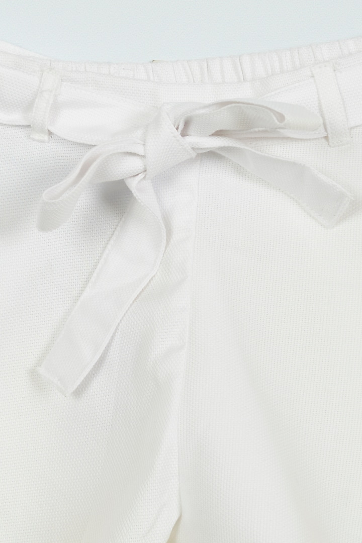 White Dobby Flared Shorts For Girls by Ambar at Pernia's Pop Up Shop