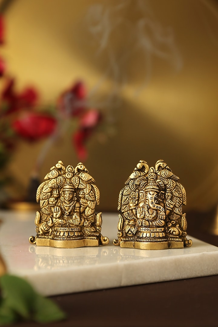 Antique Gold Laxmi & Ganesha Idols With Peacock Detailing (Set of 2) by Amoliconcepts at Pernia's Pop Up Shop