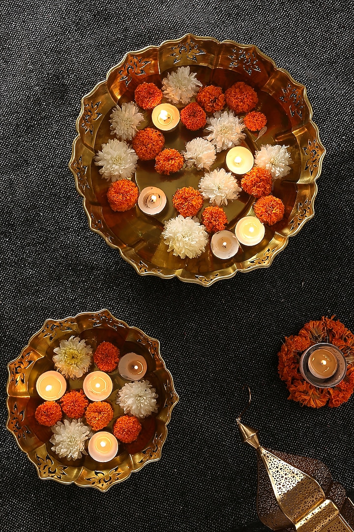 Gold Tone Iron Lotus Motif Urli (Set of 2) by Amoliconcepts at Pernia's Pop Up Shop