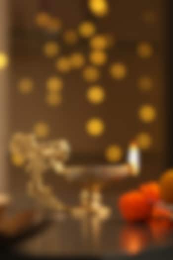 Antique Gold Brass Diya With Bird Handle by Amoliconcepts at Pernia's Pop Up Shop