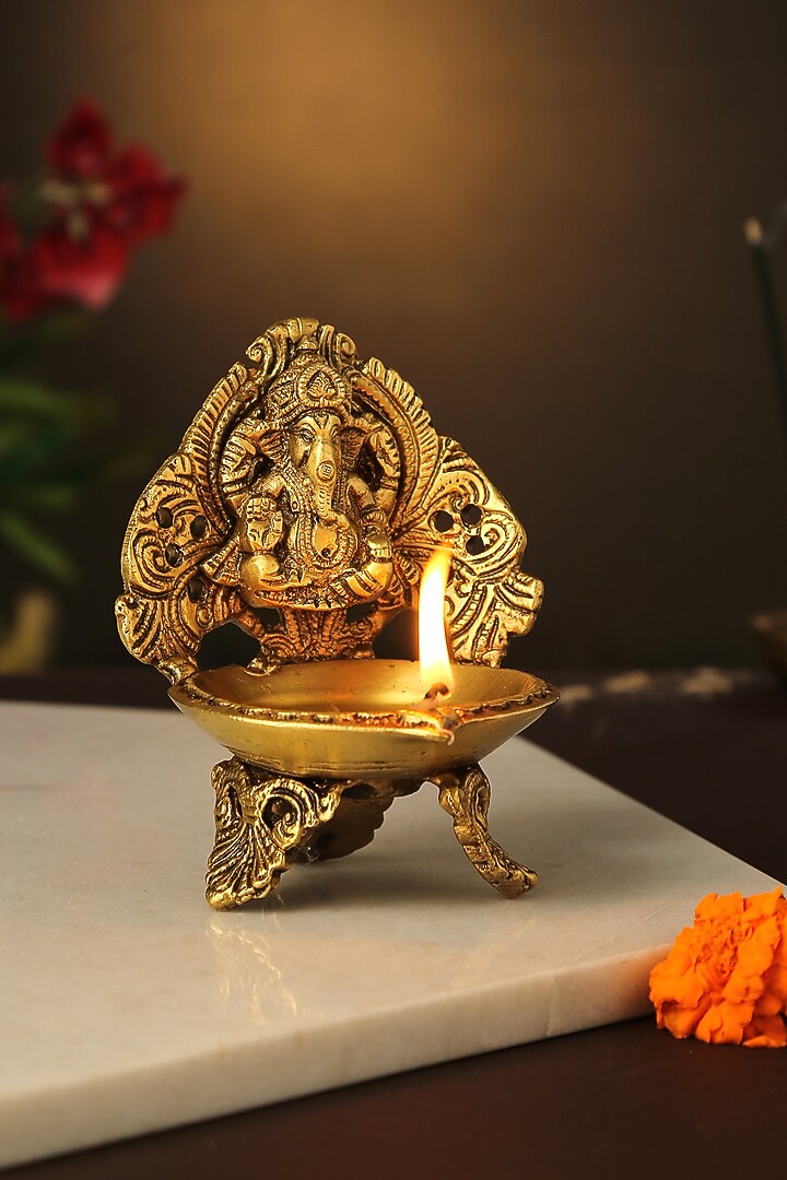 Antique Gold Brass Ganesha & Laxmi Diyas (Set of 2) by Amoliconcepts at Pernia's Pop Up Shop