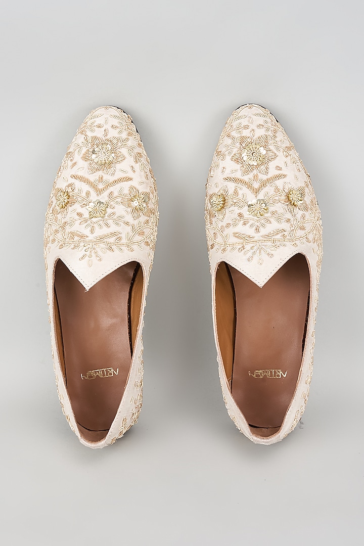 White Raw Silk Hand Embroidered Juttis by ARTIMEN