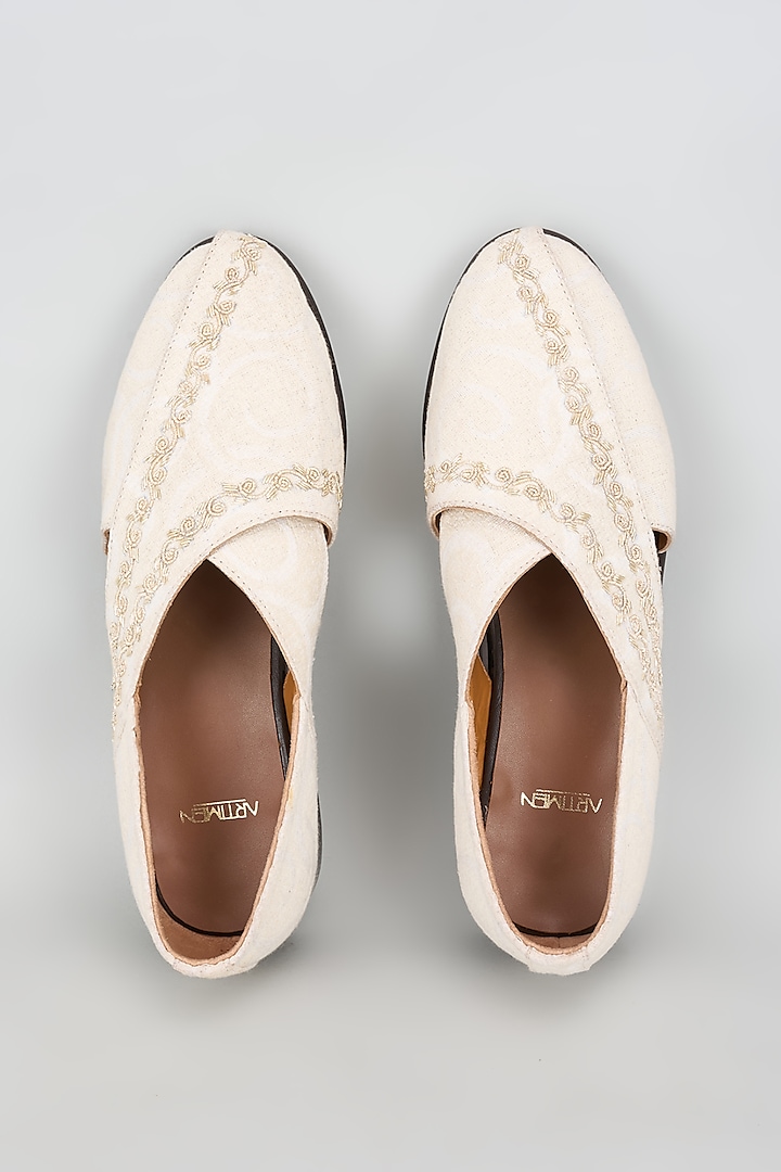 Ivory Leather Hand Embroidered Juttis by ARTIMEN