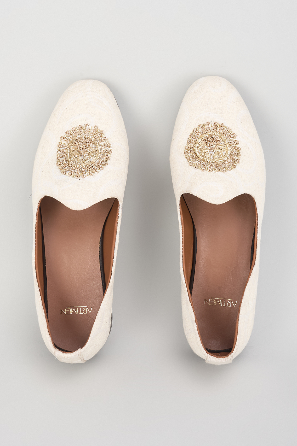 Ivory Raw Silk Hand Embroidered Juttis by ARTIMEN