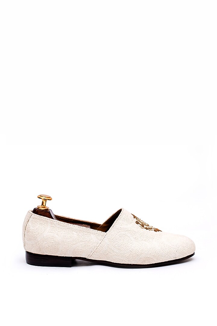 Off-White Stone Washed Fabric Handcrafted Juttis by ARTIMEN at Pernia's Pop Up Shop