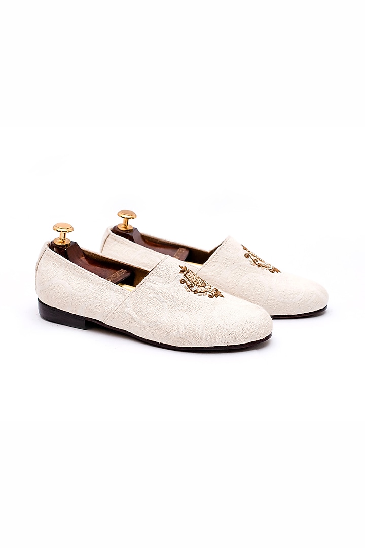 Off-White Stone Washed Fabric Handcrafted Juttis by ARTIMEN at Pernia's Pop Up Shop