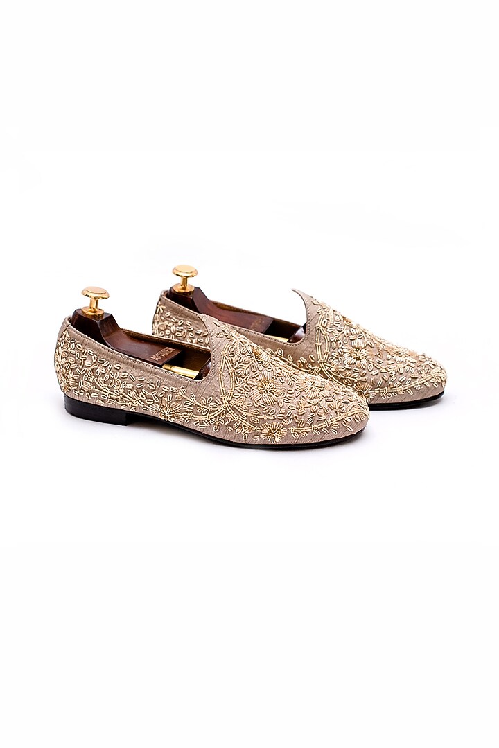 Beige Raw Silk Hand Embroidered Juttis by ARTIMEN at Pernia's Pop Up Shop