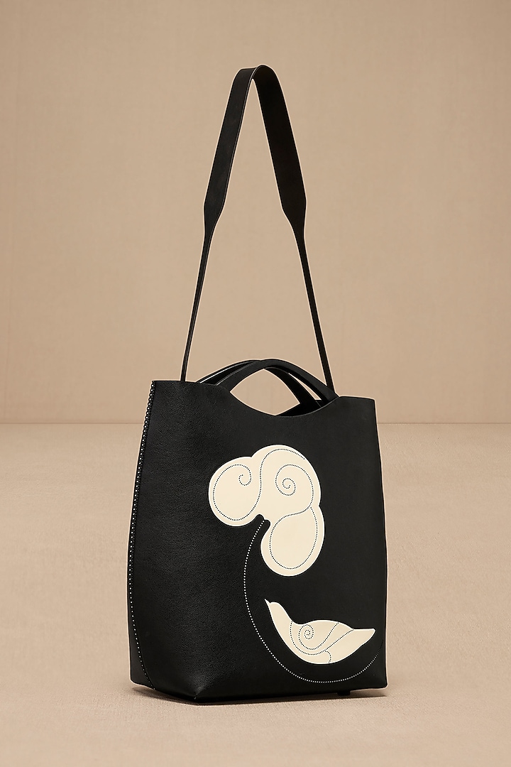 Black Faux Leather Curved Tote Bag by AMPM Accessories at Pernia's Pop Up Shop
