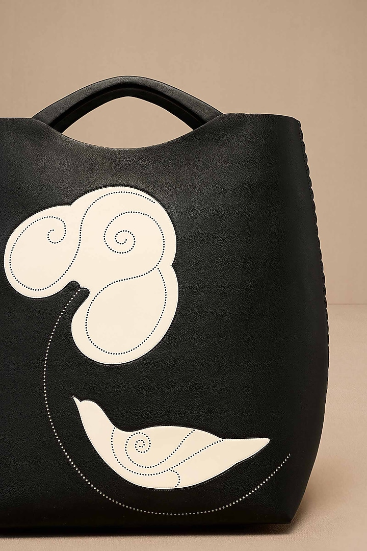 Black Faux Leather Curved Tote Bag by AMPM Accessories at Pernia's Pop Up Shop