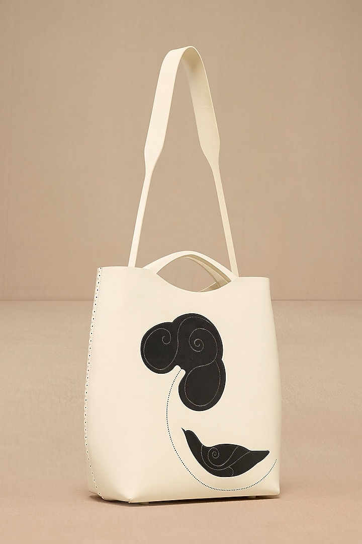 Ivory Faux Leather Curved Tote Bag by AMPM Accessories at Pernia's Pop Up Shop