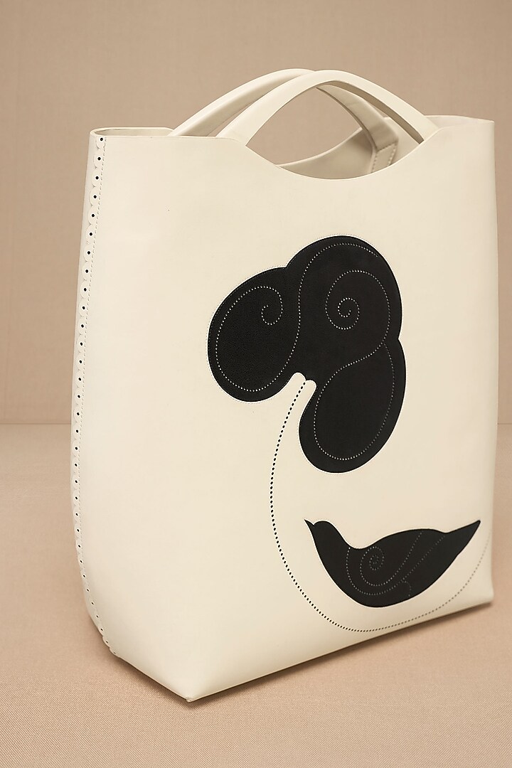 Ivory Faux Leather Curved Tote Bag by AMPM Accessories at Pernia's Pop Up Shop