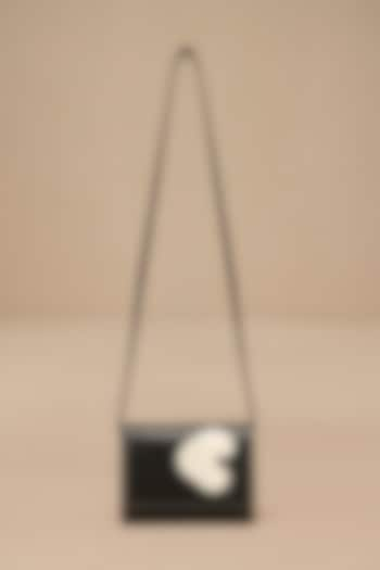 Black Faux Leather Sling Bag by AMPM Accessories at Pernia's Pop Up Shop