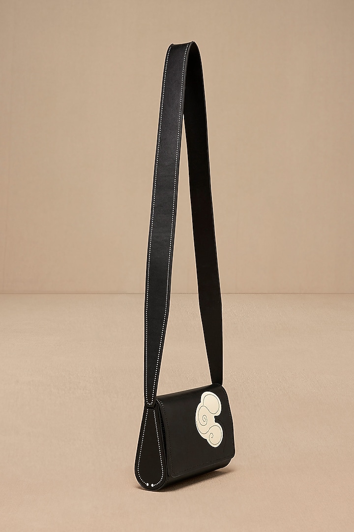 Black Faux Leather Sling Bag by AMPM Accessories at Pernia's Pop Up Shop