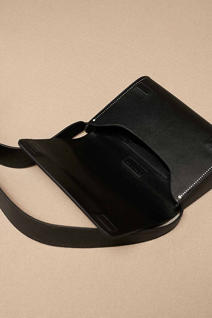 Black Faux Leather Sling Bag by AMPM Accessories at Pernia's Pop Up Shop