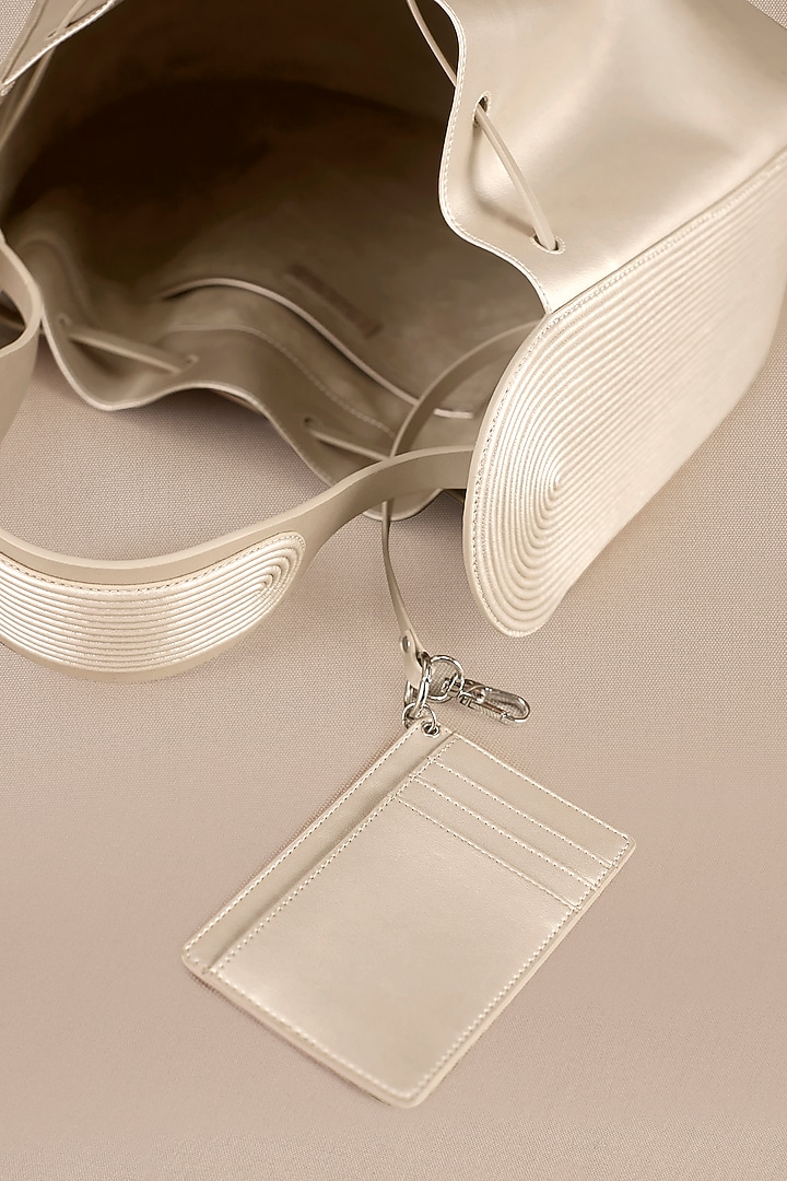 Metallic Pearl Faux Leather Bucket Bag by AMPM Accessories at Pernia's Pop Up Shop