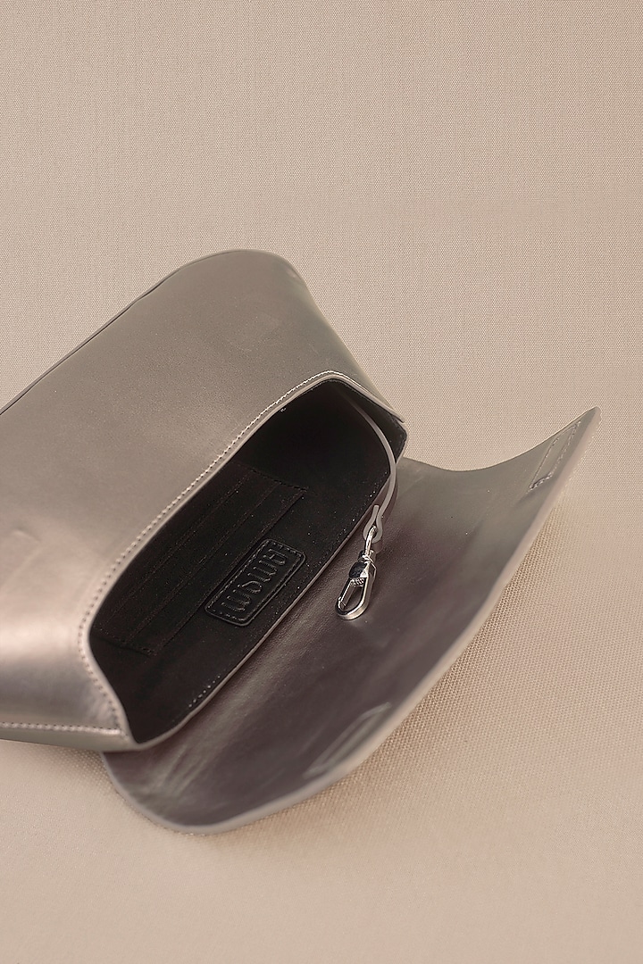 Metallic Faux Leather Corded Clutch by AMPM Accessories at Pernia's Pop Up Shop