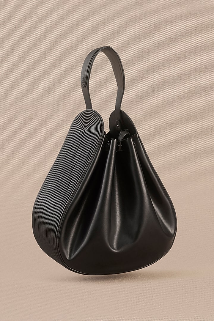 Black Faux Leather Corded Bucket Bag by AMPM Accessories at Pernia's Pop Up Shop