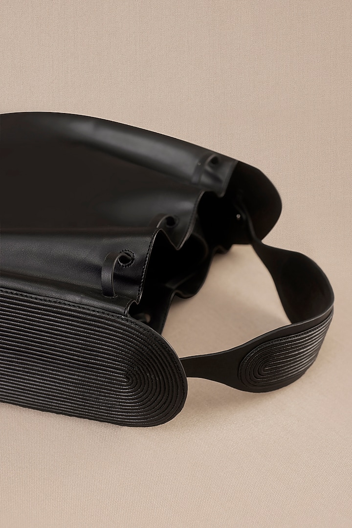 Black Faux Leather Corded Bucket Bag by AMPM Accessories at Pernia's Pop Up Shop