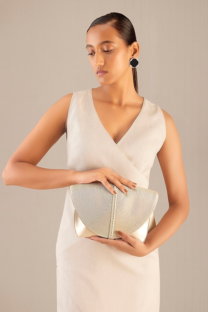 White Faux Leather Metallic Clutch by AMPM Accessories at Pernia's Pop Up Shop