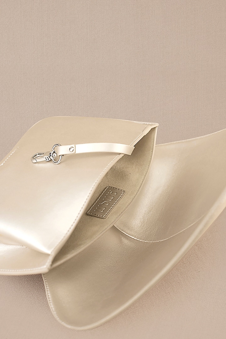 White Faux Leather Metallic Clutch by AMPM Accessories at Pernia's Pop Up Shop