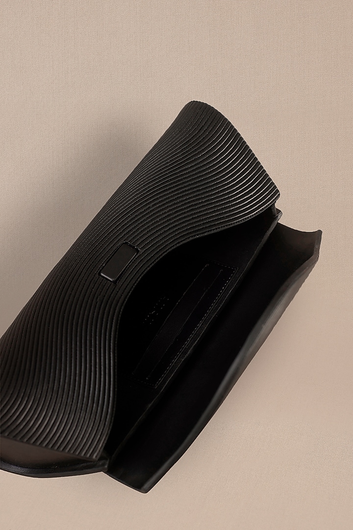 Black Faux Leather Metallic Clutch by AMPM Accessories at Pernia's Pop Up Shop