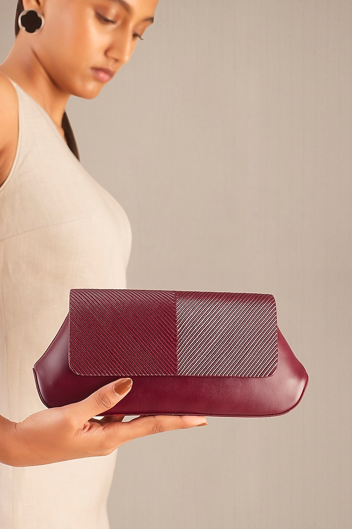 Red Faux Leather Corded Clutch by AMPM Accessories at Pernia's Pop Up Shop