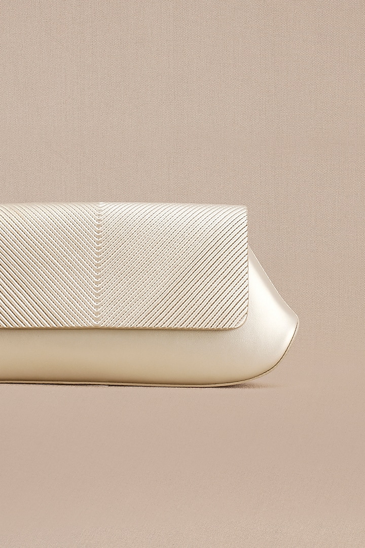 Metallic Pearl White Faux Leather Clutch by AMPM Accessories at Pernia's Pop Up Shop