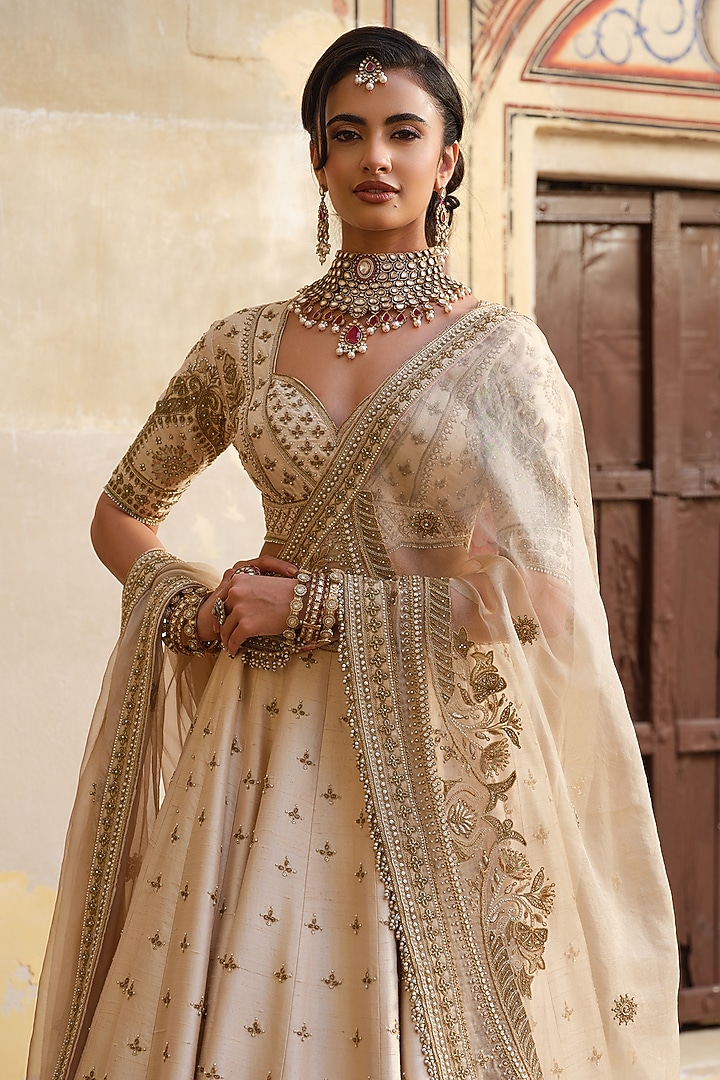 Ivory Raw Silk Zardosi Embellished Bridal Lehenga Set by AMRIN KHAN at Pernia's Pop Up Shop