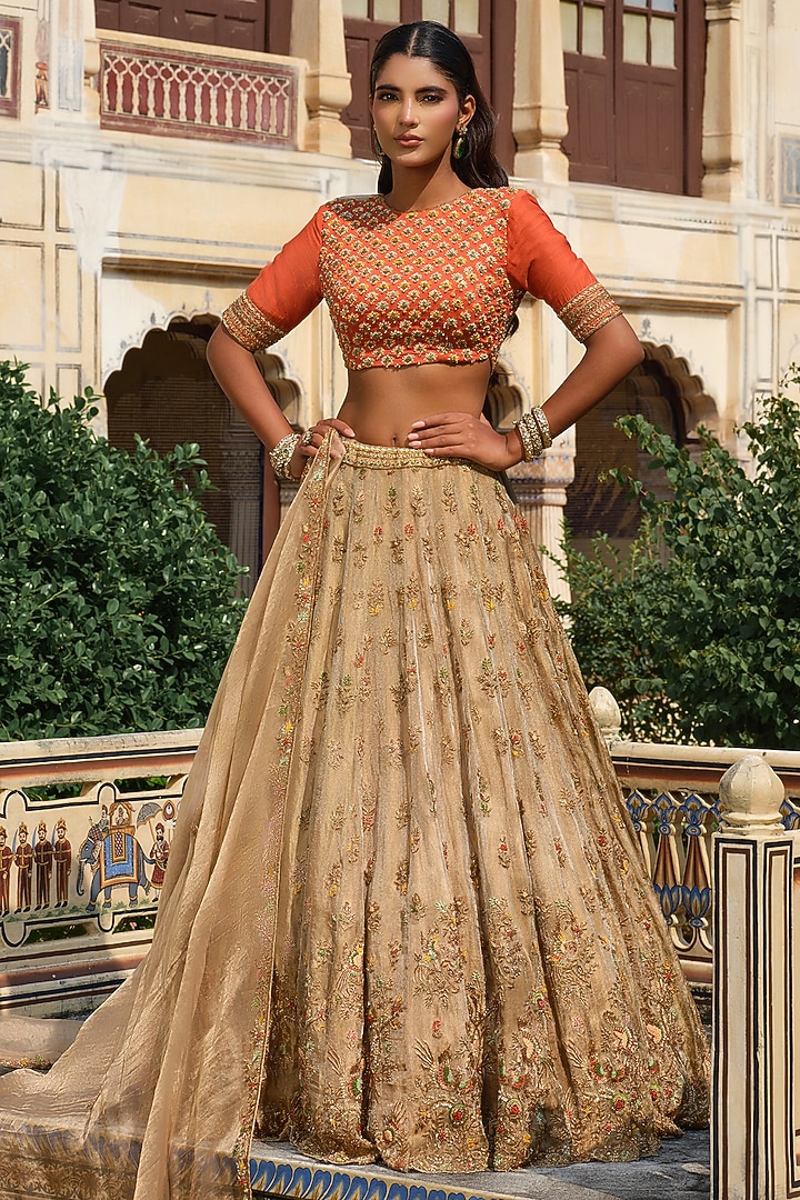 Gold Raw Silk Floral Hand Embroidered Bridal Lehenga Set by AMRIN KHAN at Pernia's Pop Up Shop